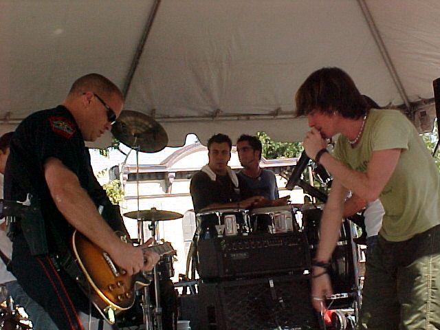 Micheal playing guitar with some local musicians